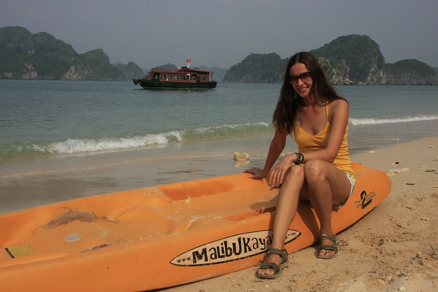 A tourist sitting on a kayak in Halong Bay, Vietnam