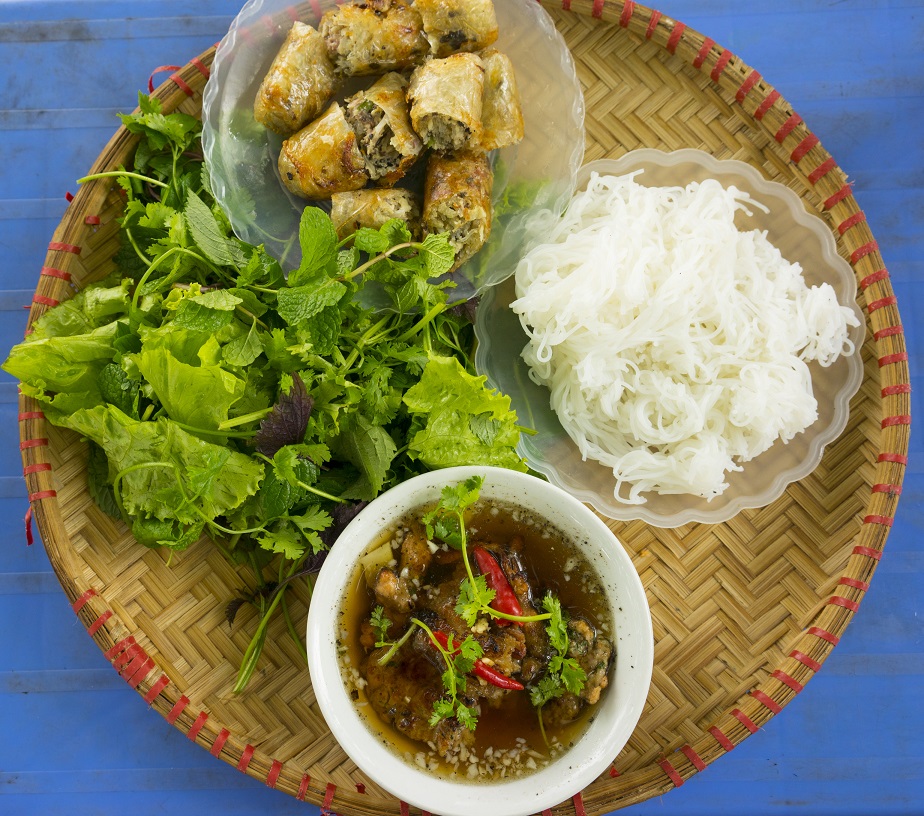 "Bun cha" - the famous vietnamese noodle soup with bbq meat, spring roll, vermicelli and fresh vegetable