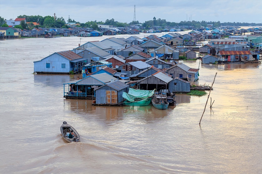 Floating village and selling motorboat on Bassac river in Chau Doc town