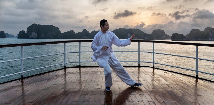 Tai Chi Exercises on a cruise in Halong Bay (photo from halongbaytours.com)