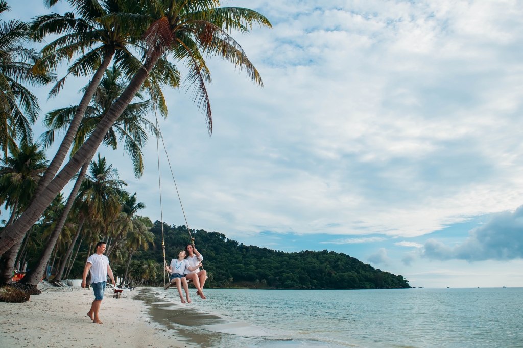 A Family on swing at a beach of Phu Quoc Island