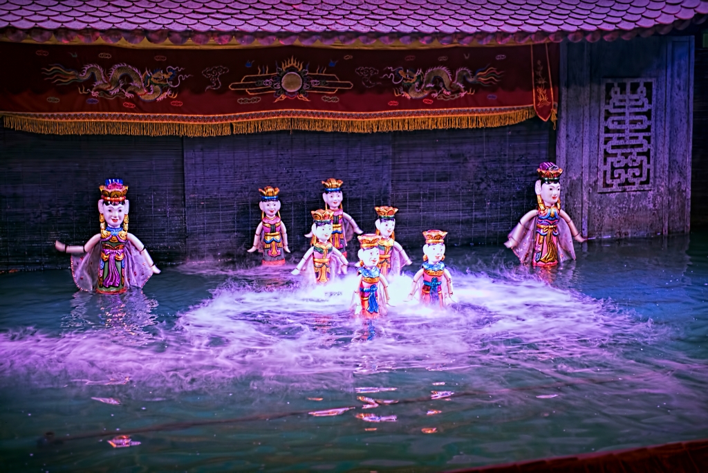 Water puppet show in Vietnam under purple lights