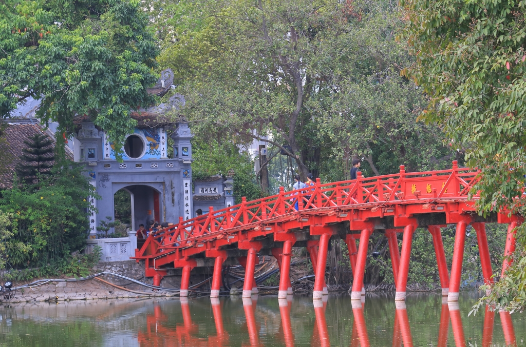 The wooden red “Rising Sun Bridge” leading to Ngoc Son Temple in Hanoi city