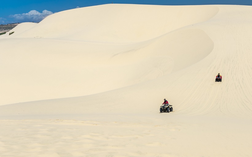 Travelers are experiencing the thrill of crossing the white sand dunes