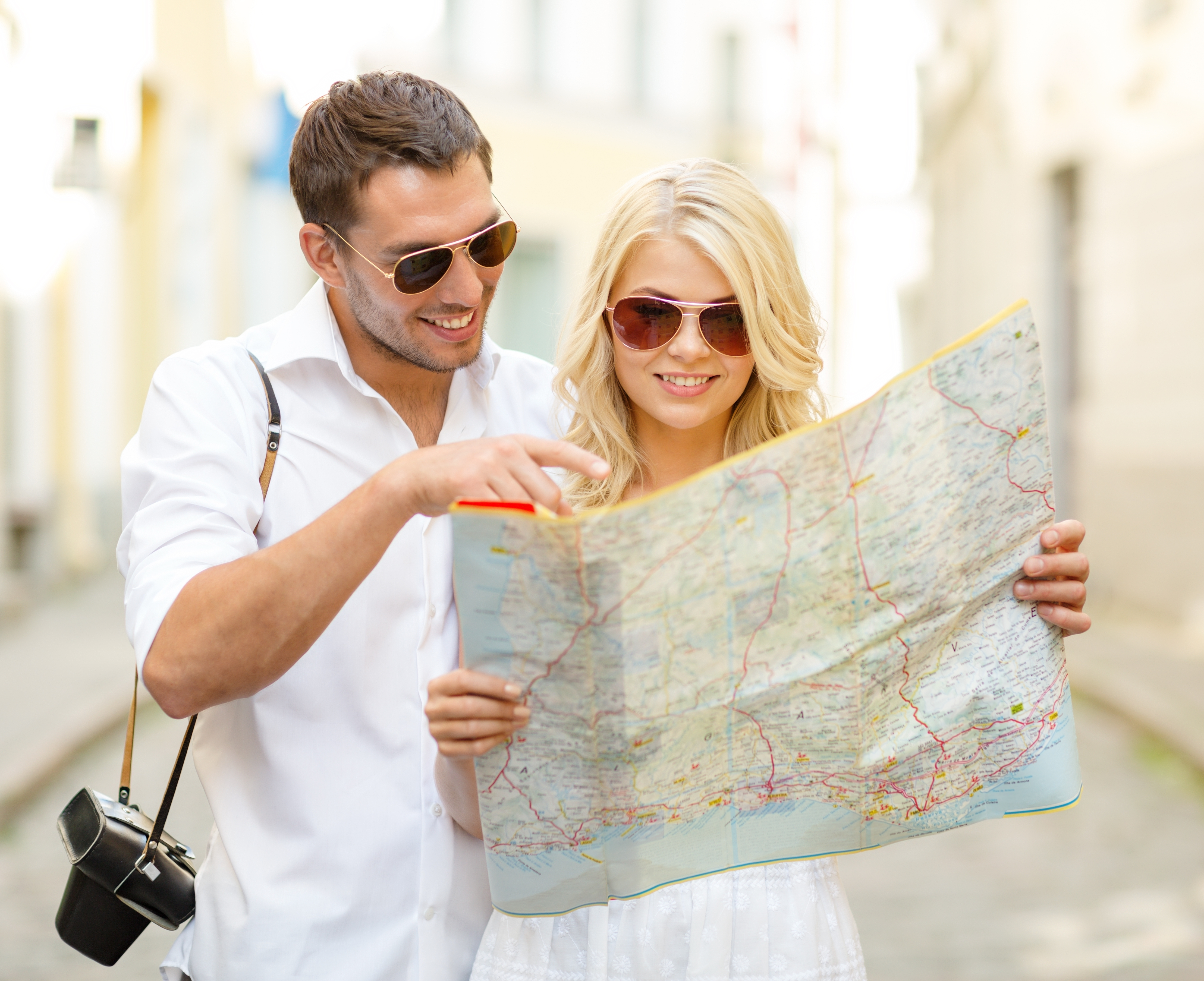 smiling couple with the map