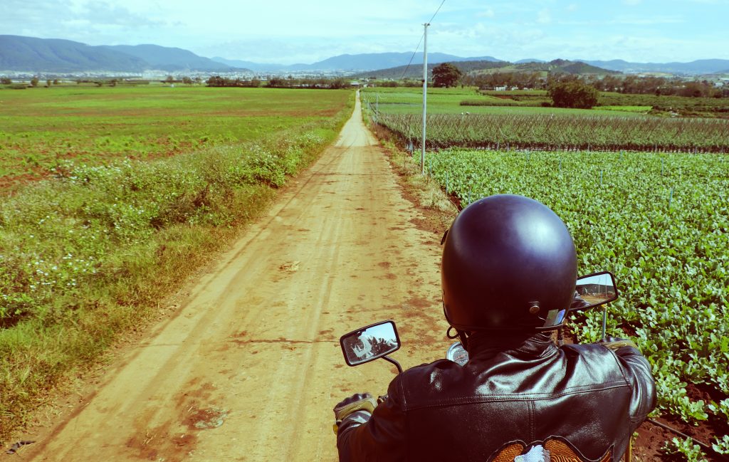 Riding motorbike on Vietnamese countryside road