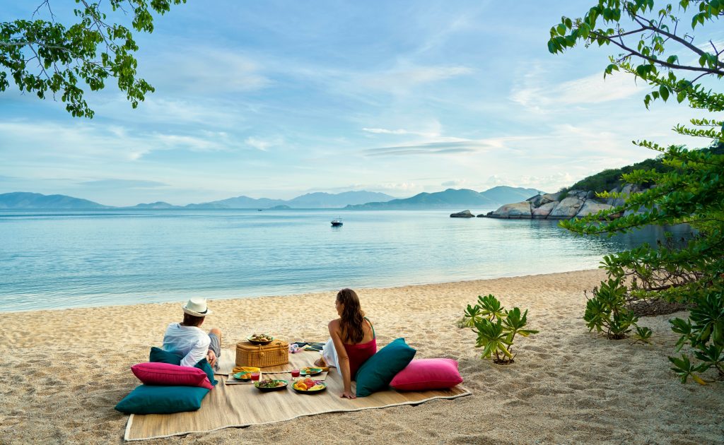 Tourist enjoy private beach at Ninh Van Bay