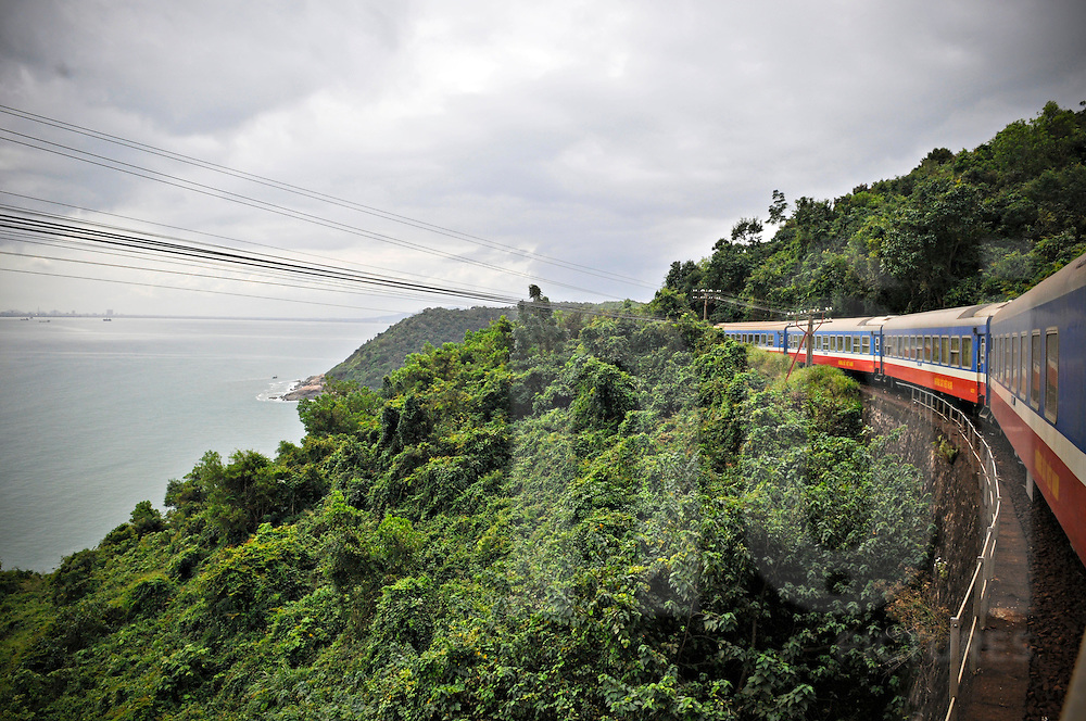 Train crosses a jungle landscape between Hue and Danang at the Hai Van Pass